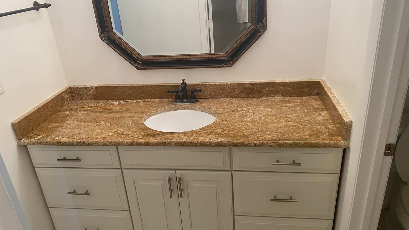 Light bathroom vanity after cabinet refresh
